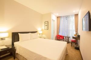Voodi või voodid majutusasutuse Dinh Ami Hanoi Hotel toas