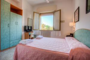 Postel nebo postele na pokoji v ubytování Albergo Villa Lucia