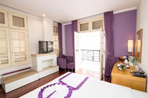Postel nebo postele na pokoji v ubytování TTC Hotel - Ngoc Lan