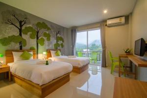 Postel nebo postele na pokoji v ubytování Ao Nang Miti Resort + 34 fotografií