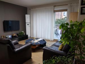 TV a/nebo společenská místnost v ubytování Tongyeong Episode Guesthouse