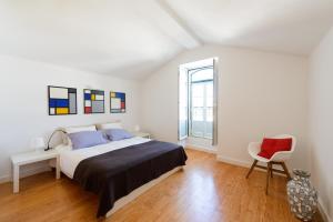 Ένα ή περισσότερα κρεβάτια σε δωμάτιο στο Timeless apartment at the heart of the village II