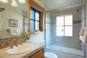 a bathroom with a sink and a shower at Northstar - Sierra Gold Home in Kingswood Estates