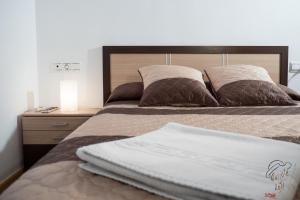 Кровать или кровати в номере Apartamento Quixote Loft Almagro