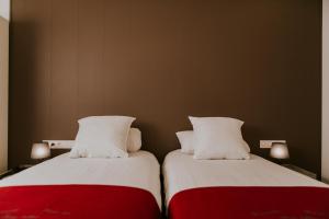Ένα ή περισσότερα κρεβάτια σε δωμάτιο στο Hotel New Regina