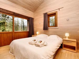 a bedroom with a bed with two towels on it at Luxurious Villa with Private Pool in Durbuy in Grandhan