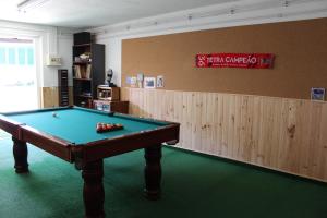 a billiard room with a pool table in a room at Hostel Casa Lucas in Charneca
