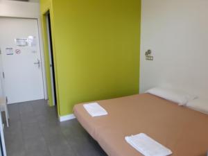 Postel nebo postele na pokoji v ubytování UBA Hostel