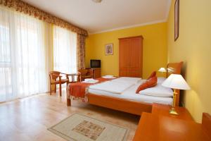 Postel nebo postele na pokoji v ubytování Hotel Járja