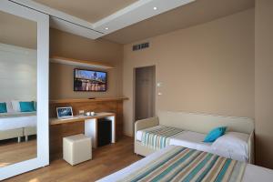 TV a/nebo společenská místnost v ubytování Hotel Concord
