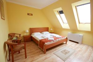 Postel nebo postele na pokoji v ubytování Hotel Járja