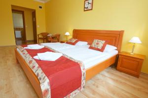 Postel nebo postele na pokoji v ubytování Hotel Járja