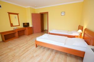 Postel nebo postele na pokoji v ubytování Hotel Járja