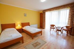 Postel nebo postele na pokoji v ubytování Hotel Járja
