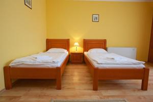 Postel nebo postele na pokoji v ubytování Hotel Járja