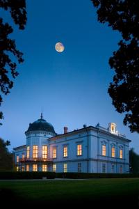 a large building with a moon in the sky at Park Hotel Tartuf in Beladice