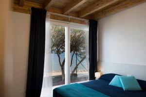 Postel nebo postele na pokoji v ubytování Camping Bergamini + 37 fotografií