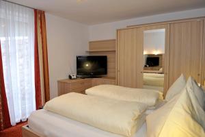 Posteľ alebo postele v izbe v ubytovaní Apartmenthaus Sonnenhang