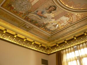 a painting of a woman on the ceiling of a room at Anba Boutique in Barcelona