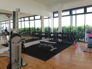 a gym with lots of treadmills and machines at Kanvas Soho by Idealhub in Cyberjaya