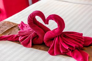 a pair of red ropes in the shape of a heart at Enjoy Beach in Bophut