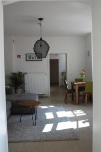 a living room with a couch and a table at Stadtvilla Würzburg in Würzburg