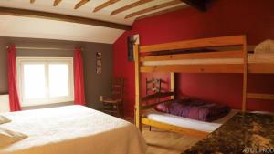 a bedroom with two bunk beds and a window at Camping et Gîte La Garenne de moncourt baie somme in Rue