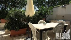 Patio nebo venkovní prostory v ubytování Nettuno Resort