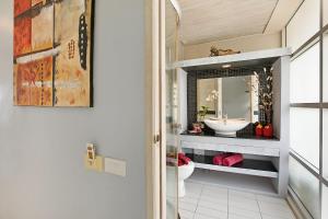 a bathroom with a sink and a toilet at Enjoy Beach in Bophut