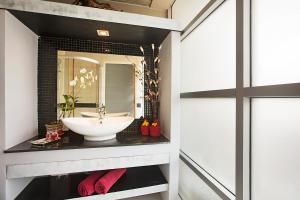 a bathroom with a sink and a mirror at Enjoy Beach in Bophut