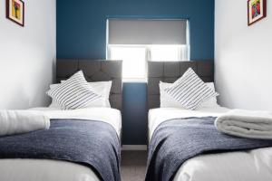 Letto o letti in una camera di Second Nest Waterloo