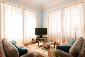 Телевизор и/или развлекательный центр в Ericeira Soul Guesthouse
