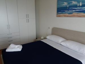 En eller flere senge i et værelse på Casa Cinzia Bonassola Cinque Terre