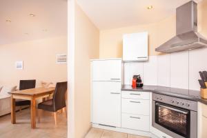 Kuchyň nebo kuchyňský kout v ubytování AlpinAppartements Stöckl + 13 fotografií