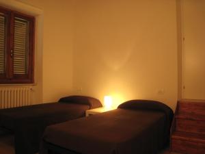 Postel nebo postele na pokoji v ubytování Rinathos Guesthouse