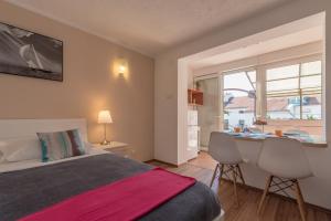 En eller flere senge i et værelse på Apartments Magdalena