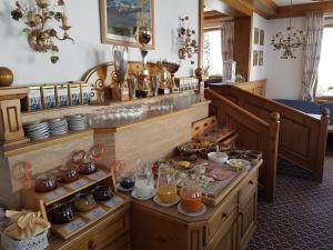a room with a bunch of food on display at Haus Widdersteinblick in Riezlern
