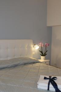 Posteľ alebo postele v izbe v ubytovaní B&B Palazzo Rochira