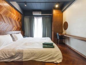 A bed or beds in a room at Suneta Hostel Chiangmai
