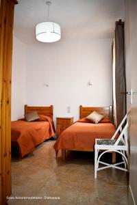 Łóżko lub łóżka w pokoju w obiekcie Cesca Apartments - Marsalforn, GOZO