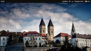 a building with a clock tower on top of it at Veszprem city center in Veszprém