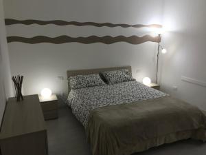 Posteľ alebo postele v izbe v ubytovaní Appartamenti Giada