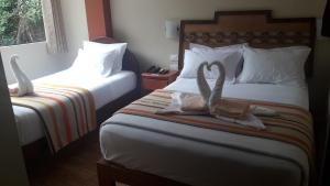 Voodi või voodid majutusasutuse Hostal Vista Waynapata 123 toas