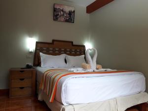 Voodi või voodid majutusasutuse Hostal Vista Waynapata 123 toas