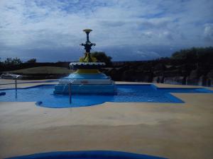 a fountain in the middle of a pool of water at The Sandgate in Skegness