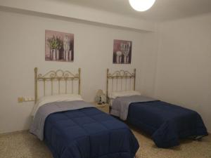 Apartamento Alameda de Andalucía de Antequeraにあるベッド