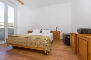 Ein Bett oder Betten in einem Zimmer der Unterkunft Apartment Lina