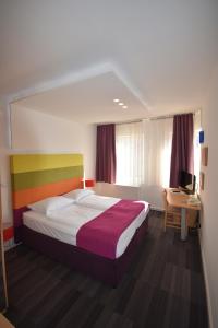 Ένα ή περισσότερα κρεβάτια σε δωμάτιο στο Hotel Hecco