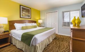 a bedroom with a large bed and a television at WorldMark Mariner Village in Ocean Shores +41 photos