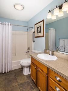 a bathroom with a sink and a toilet and a shower at WorldMark Mariner Village in Ocean Shores